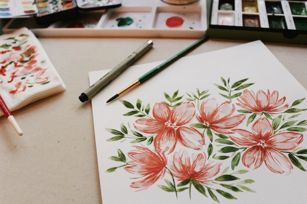 painting of red petaled flowers