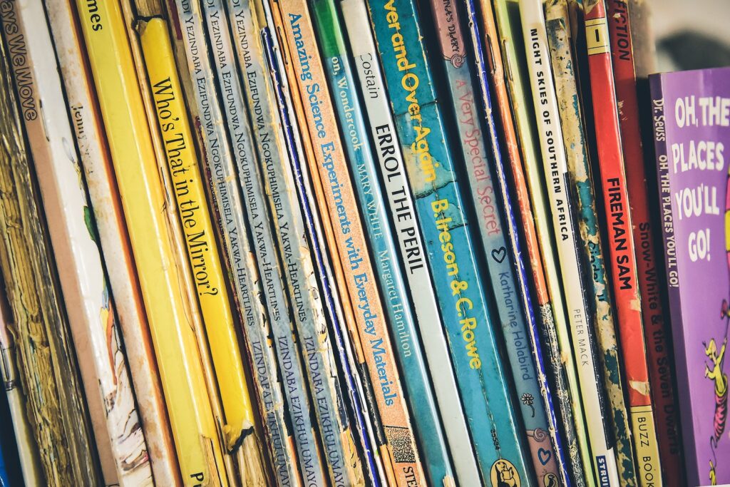 various children's book on shelf